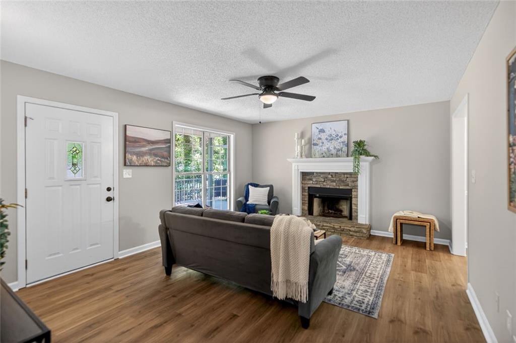 190 Killian Street Canton, GA 30114 - Photo 8 of 44 a living room with furniture and a fireplace