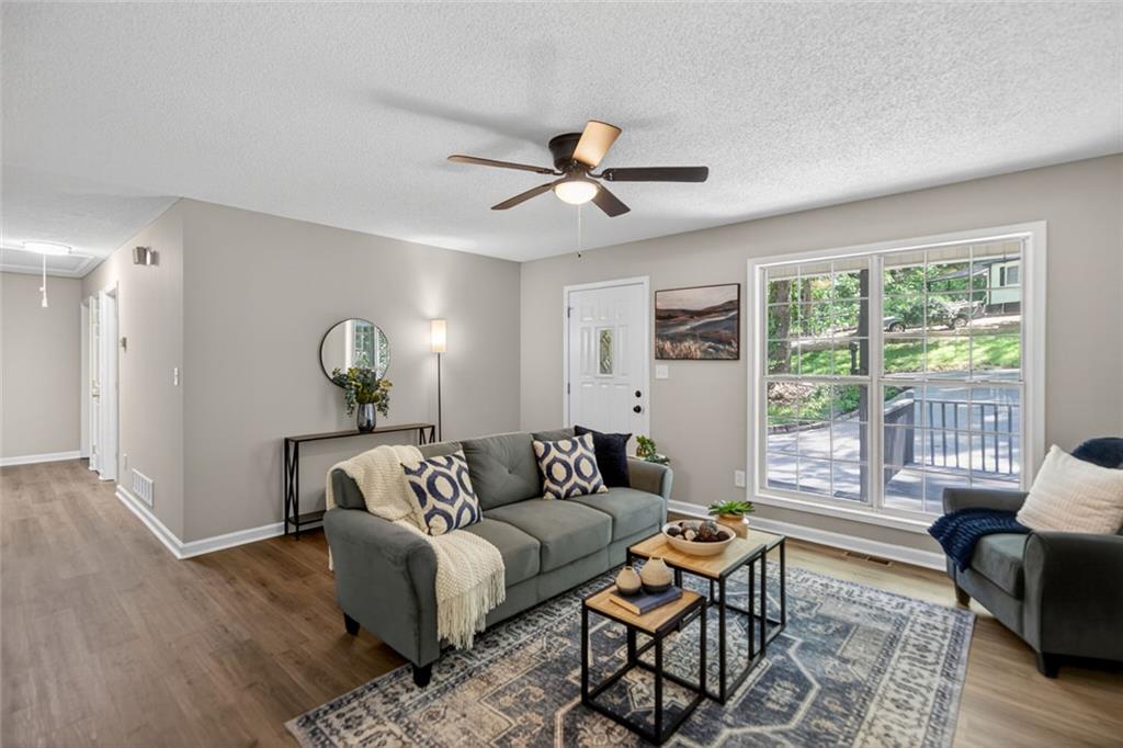 190 Killian Street Canton, GA 30114 - Photo 9 of 44 a living room with furniture and a large window