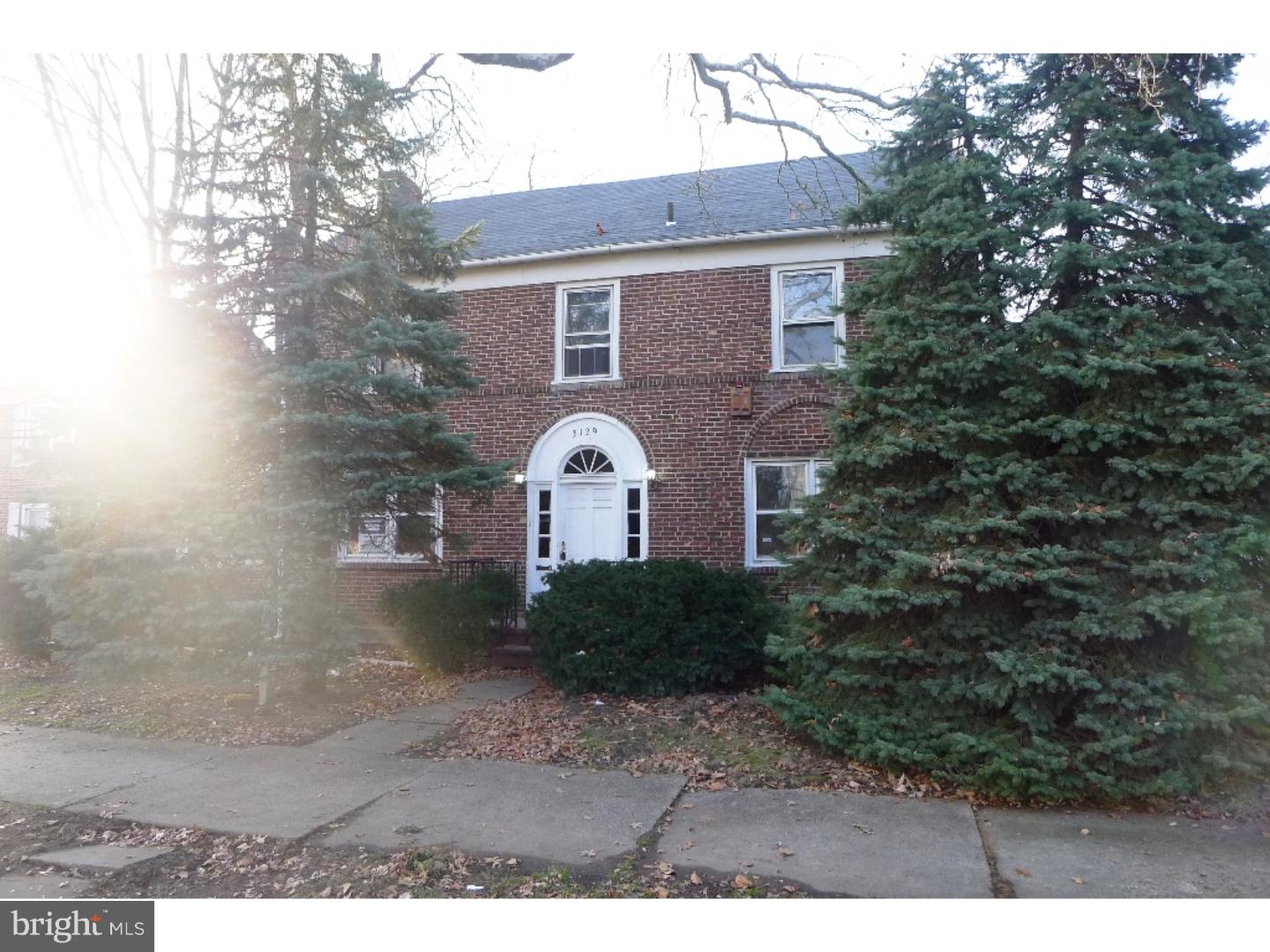 3129 South Atlanta Road Camden, NJ 08104 - Photo 1 of 13 a front view of a house with garden