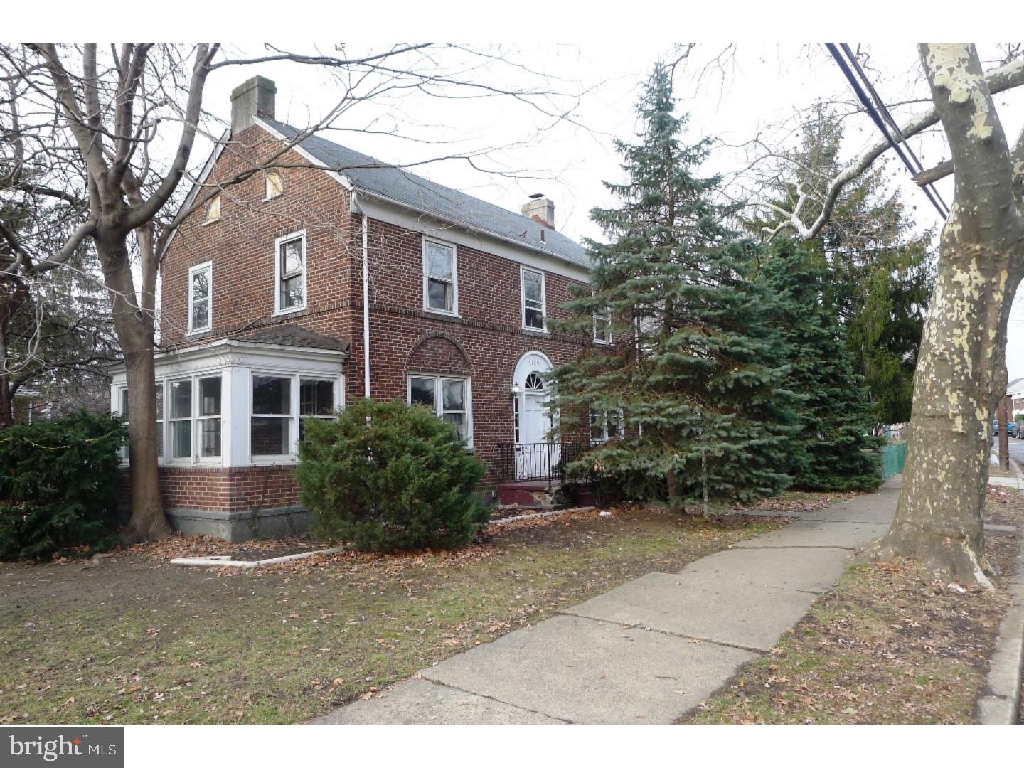 3129 South Atlanta Road Camden, NJ 08104 - Photo 2 of 13 a front view of a house with a yard