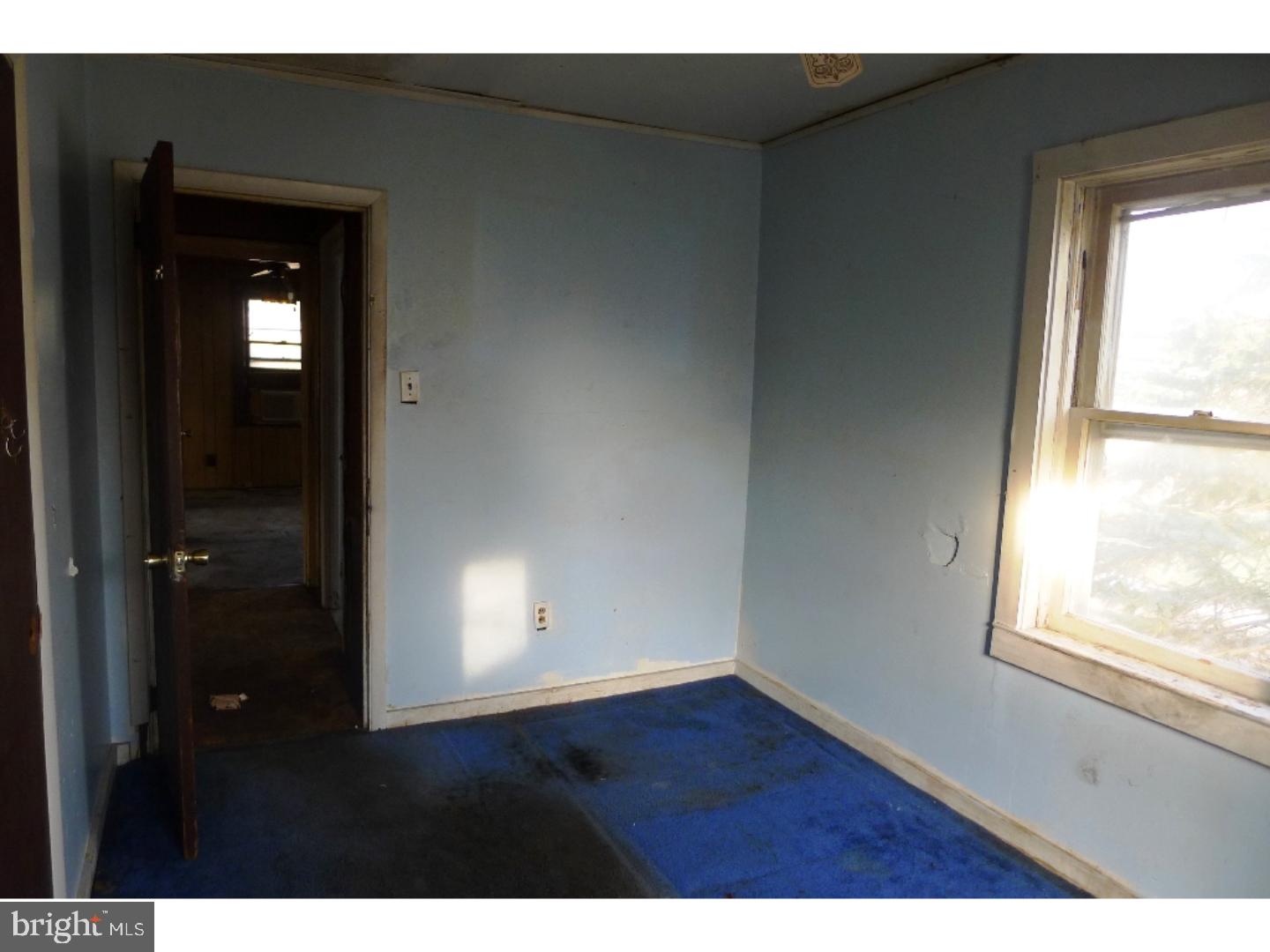 3129 South Atlanta Road Camden, NJ 08104 - Photo 13 of 13 a view of an empty room with wooden floor and a window