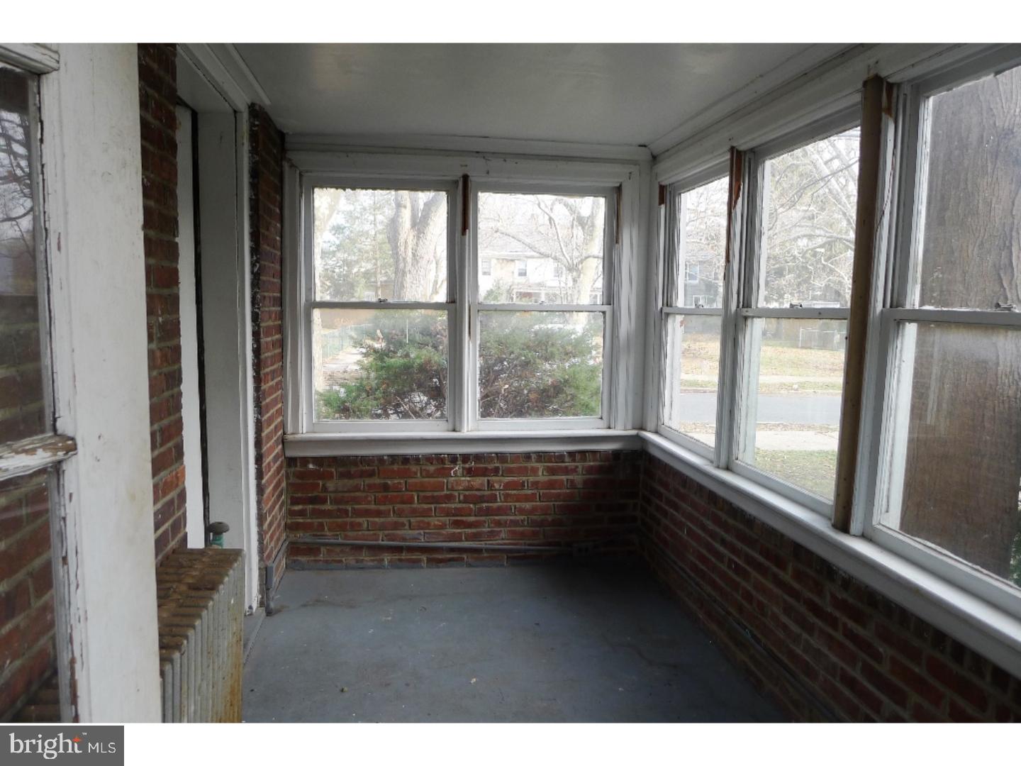 3129 South Atlanta Road Camden, NJ 08104 - Photo 8 of 13 a view of wooden floor and windows in an empty room