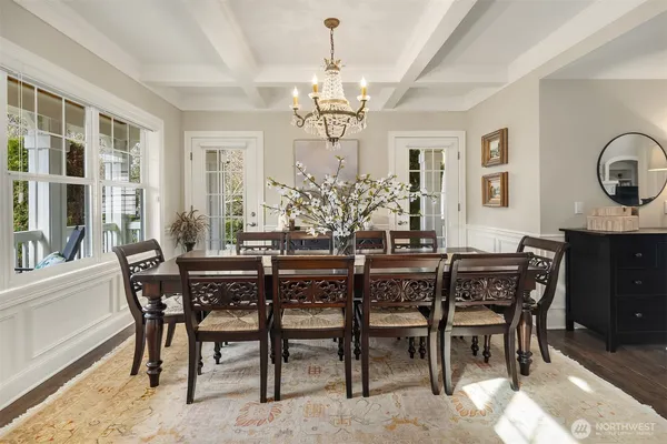 a large kitchen with a table and chairs