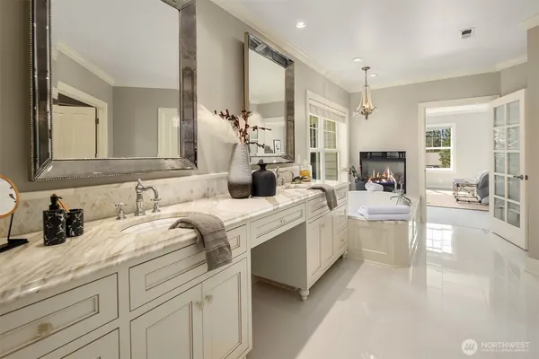 a bathroom with a sink double vanity and a mirror