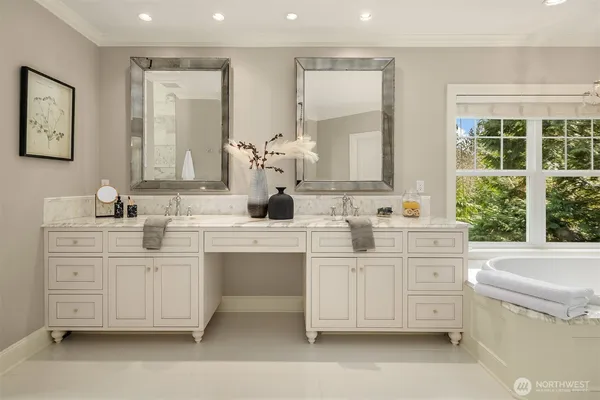 a spacious bathroom with a tub and sink