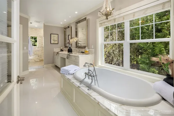 a bedroom with a bed chair and window