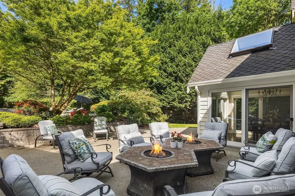 a view of a patio with table and chairs and potted plants
