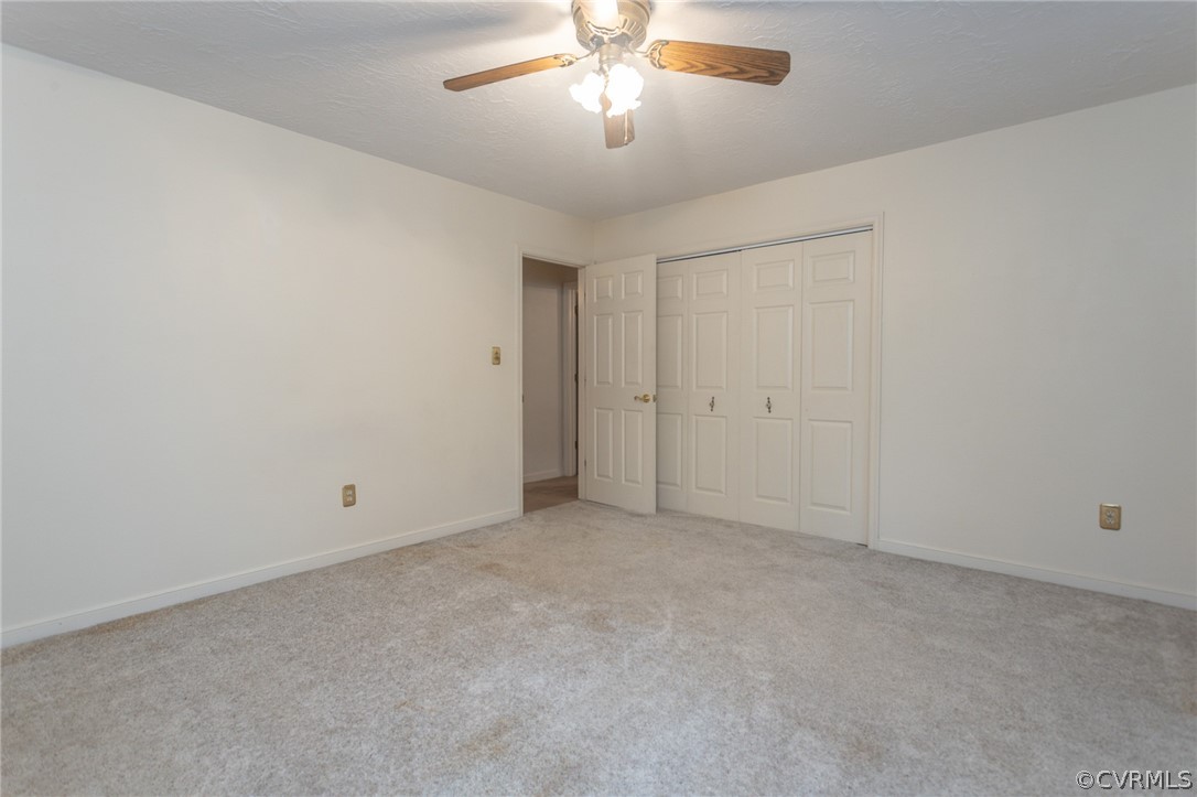 3840 Doe Run Road Hopewell, VA 23860 - Photo 33 of 46 an empty room with chandelier fan