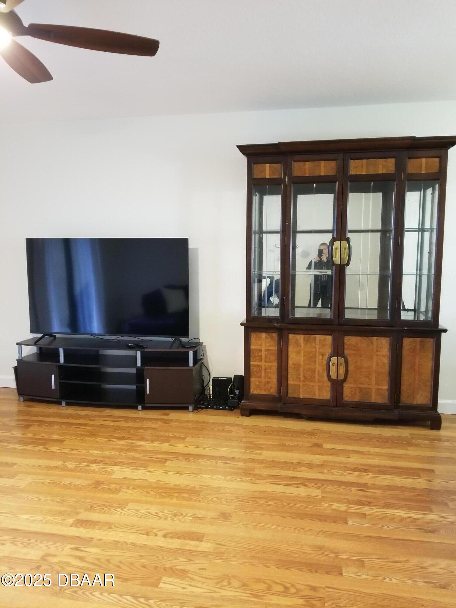 165 White Fawn Drive, Unit MB Daytona Beach, FL 32114 - Photo 12 of 34 a living room with furniture and a flat screen tv