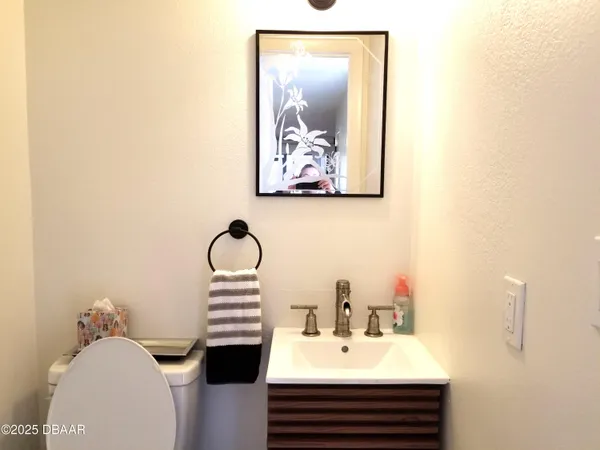 a bathroom with a sink and mirror