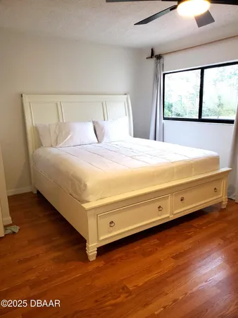 a bedroom with a bed and window