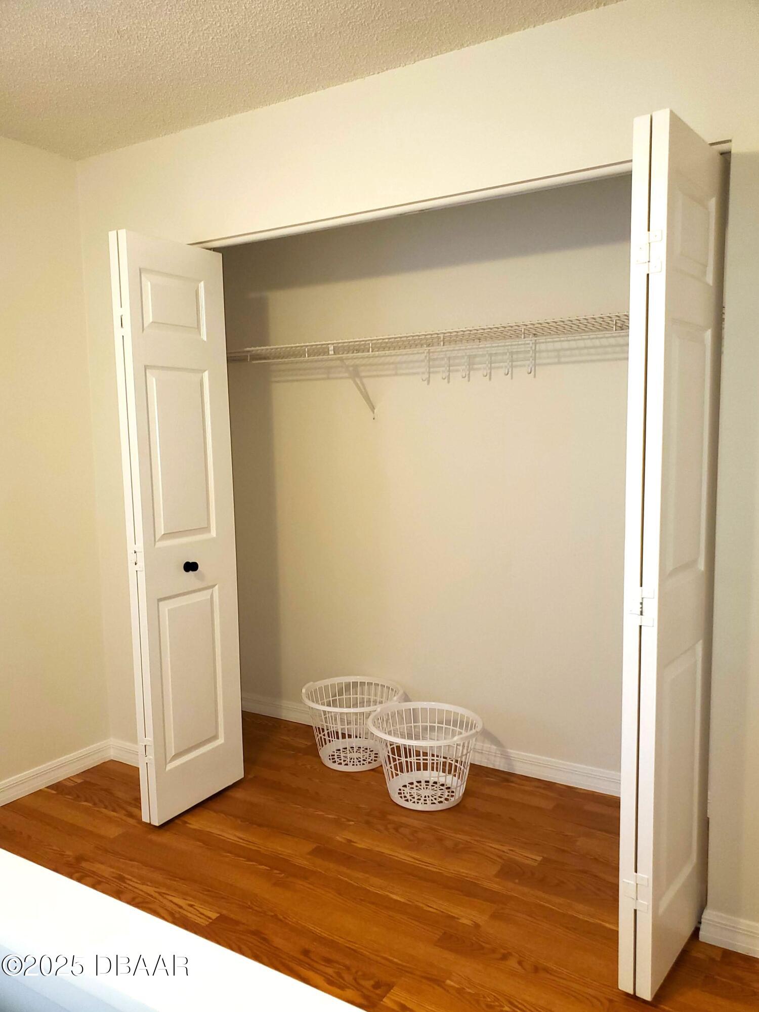 165 White Fawn Drive, Unit MB Daytona Beach, FL 32114 - Photo 29 of 34 a view of empty room with wooden floor