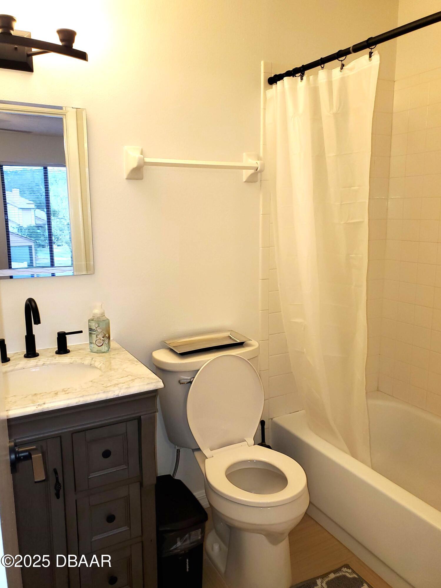 165 White Fawn Drive, Unit MB Daytona Beach, FL 32114 - Photo 32 of 34 a bathroom with a sink a toilet and shower