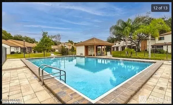 a view of swimming pool with chairs