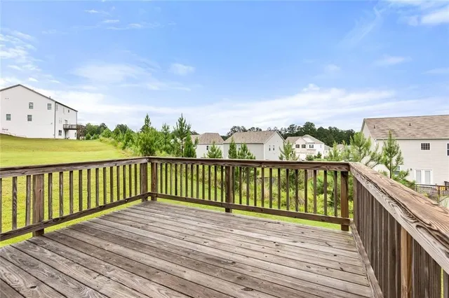 a view of balcony with wooden floor