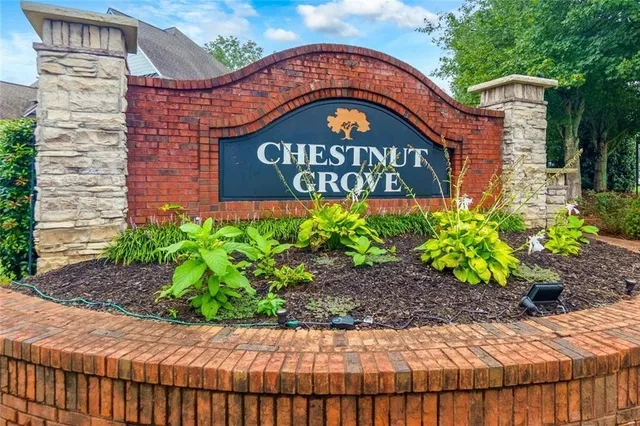 a street sign that is sitting in front of door