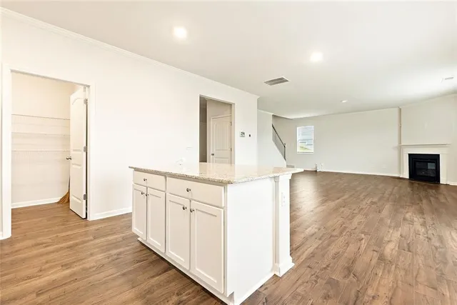 a view of a kitchen with wooden floor