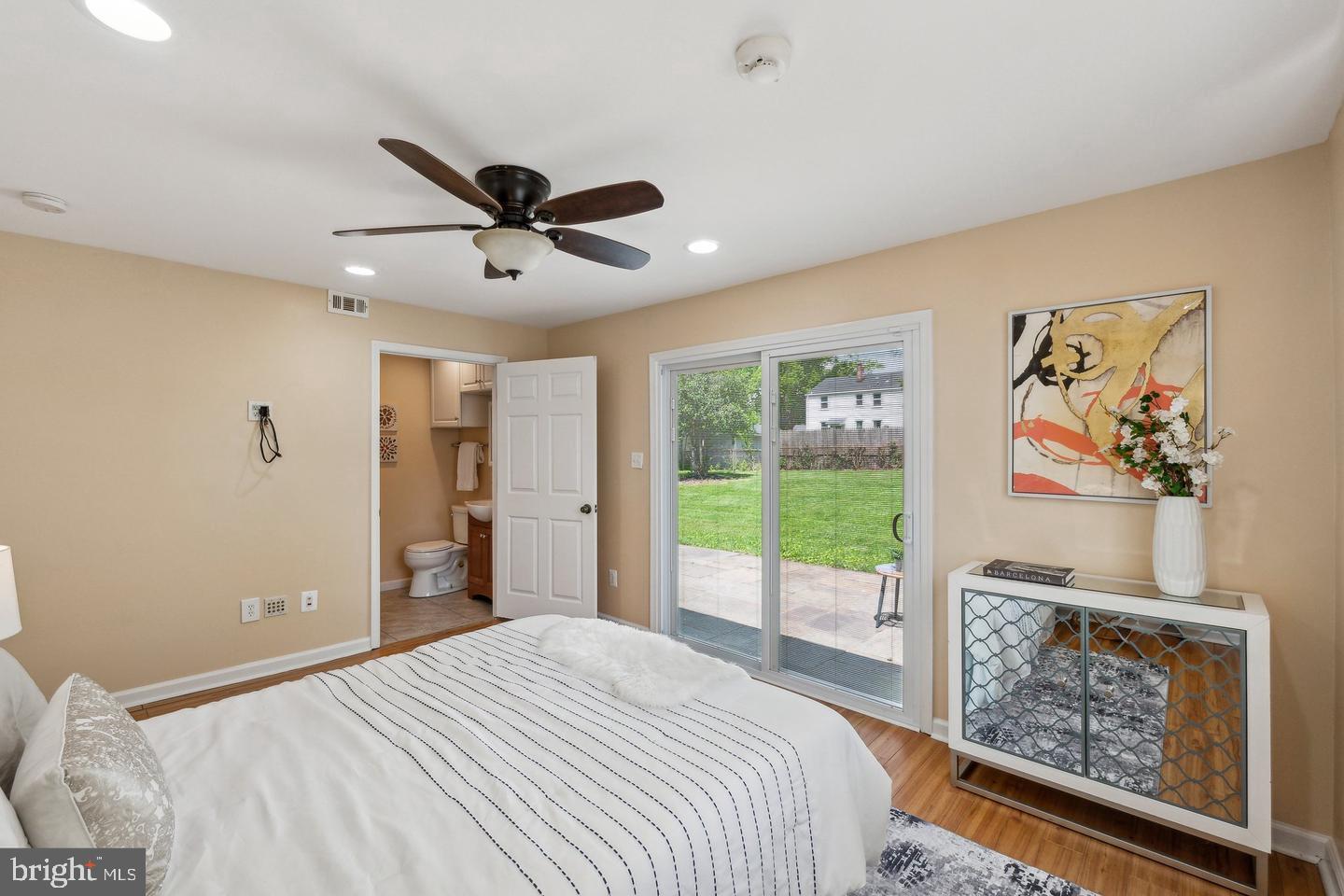 2621 Terrapin Road Silver Spring, MD 20906 - Photo 11 of 11 a bedroom with a bed and a chandelier