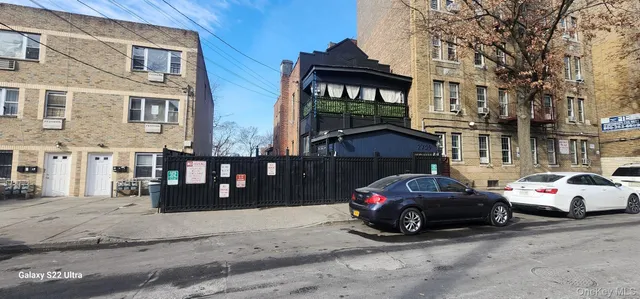 a view of a cars parked in front of a building