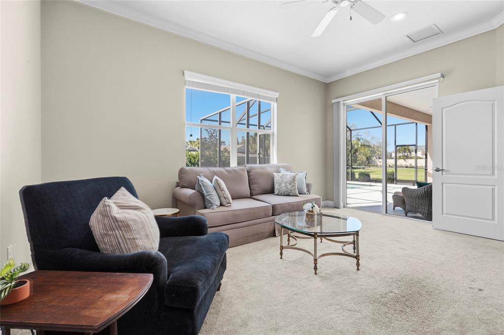357 Marsh Creek Road Venice, FL 34292 - Photo 37 of 70 a living room with furniture and a large window