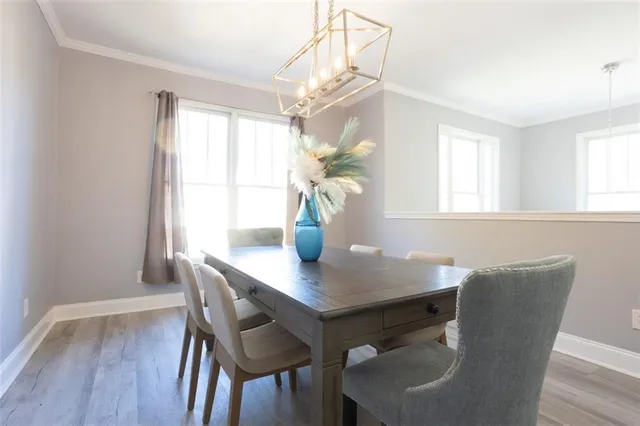a view of a dining room with furniture and window