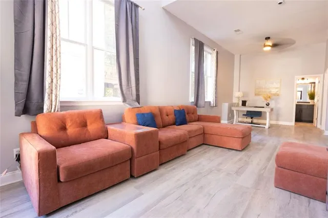 a living room with furniture and a large window
