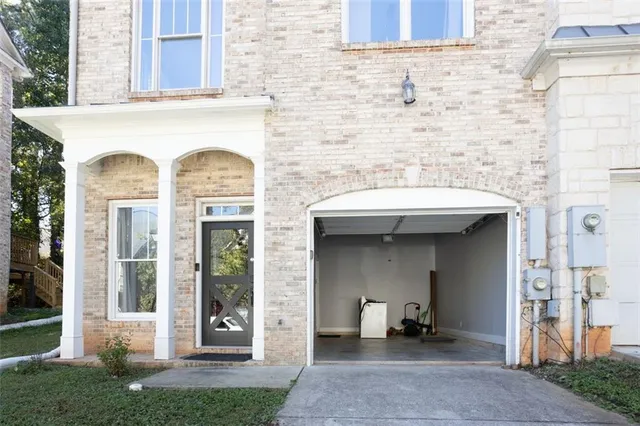 a view of a brick house with outdoor space