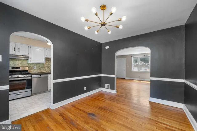 a view of kitchen with sink and wooden floor