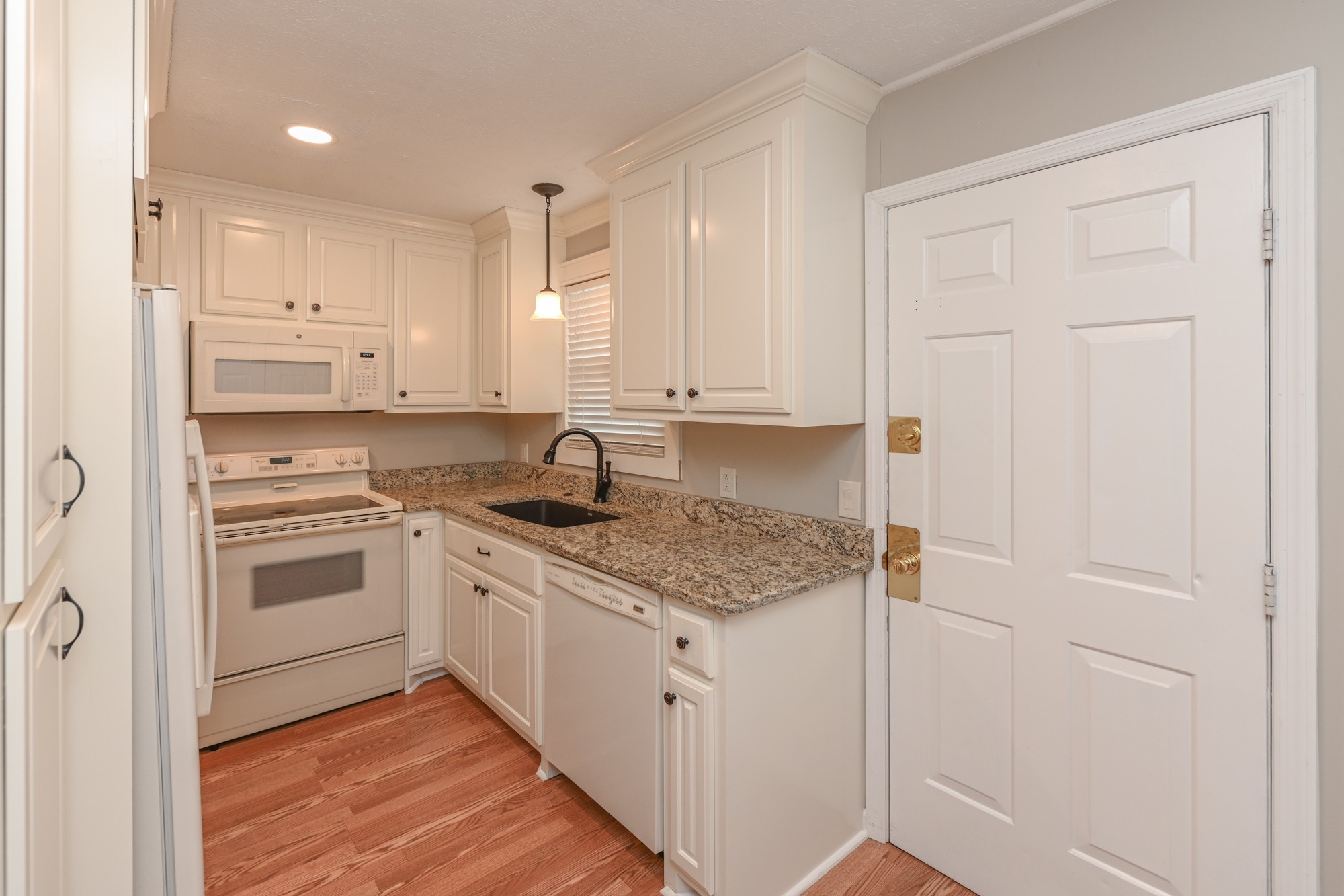 288 Donna Drive, Unit E Hendersonville, TN 37075 - Photo 11 of 23 a kitchen with stainless steel appliances granite countertop a sink and cabinets