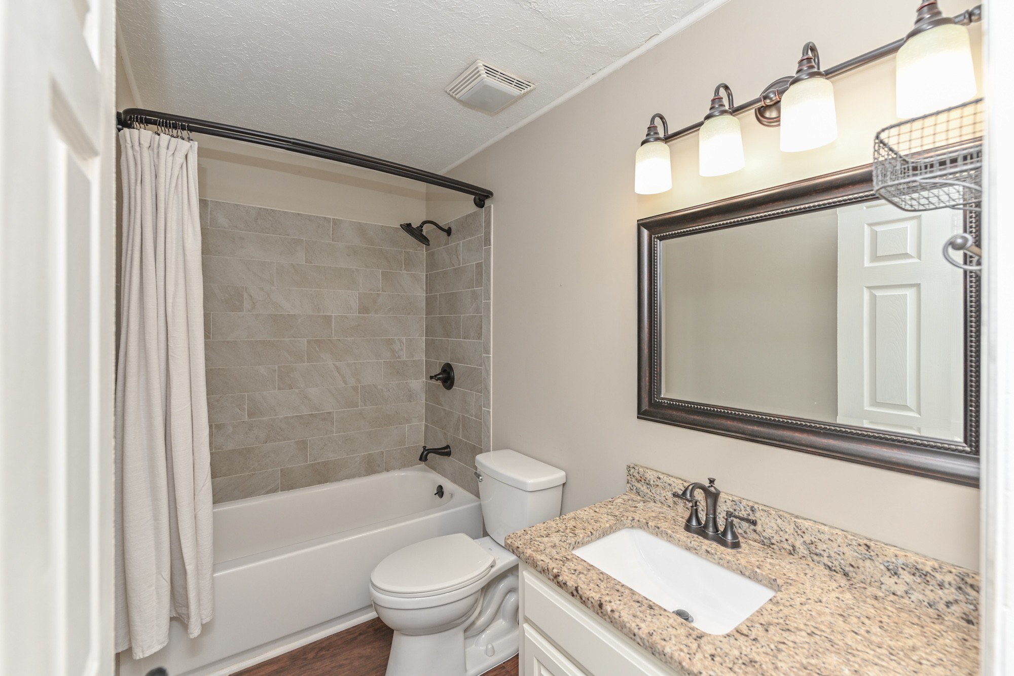 288 Donna Drive, Unit E Hendersonville, TN 37075 - Photo 17 of 23 a bathroom with a granite countertop sink toilet and shower
