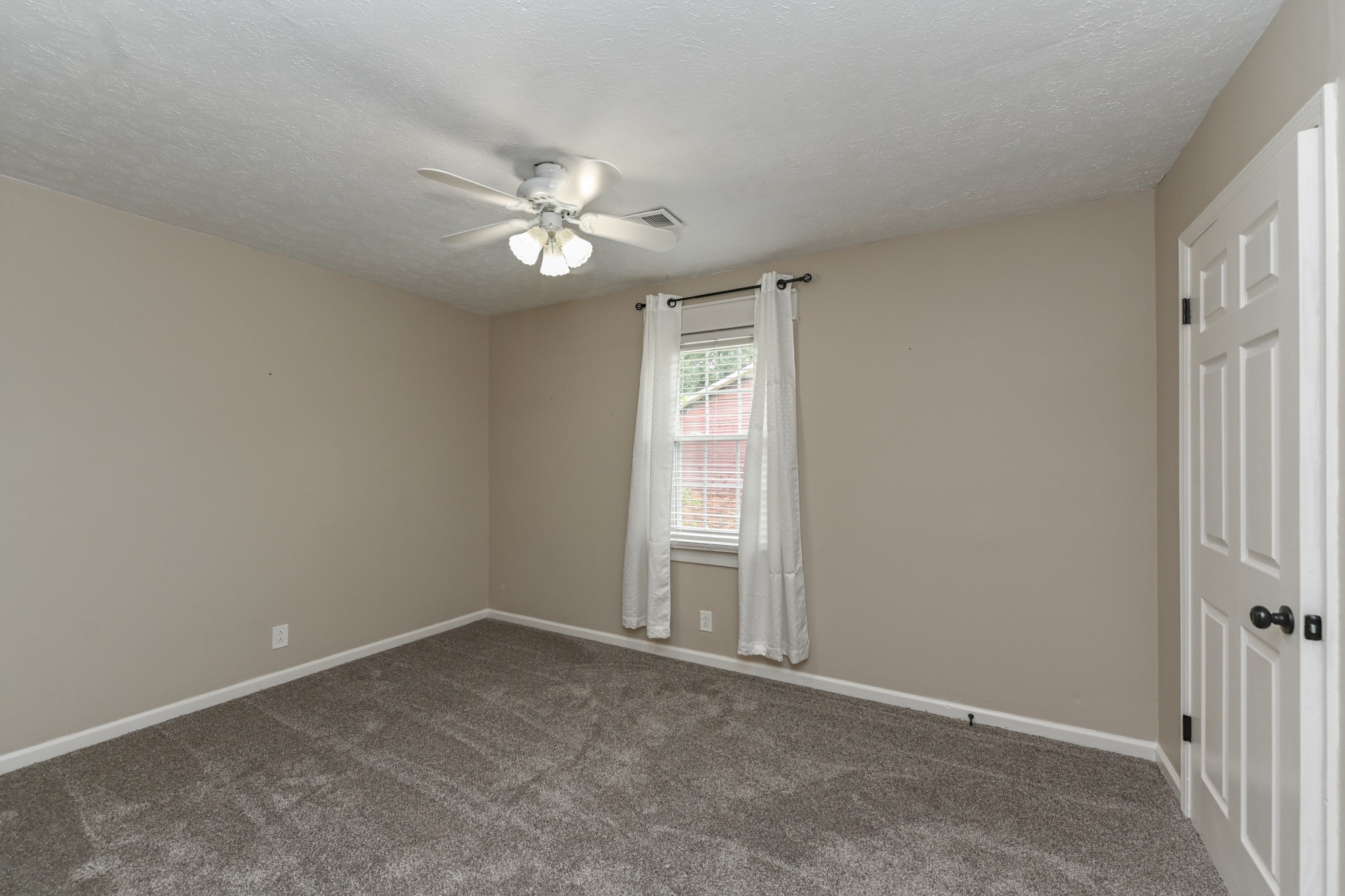288 Donna Drive, Unit E Hendersonville, TN 37075 - Photo 19 of 23 an empty room with windows and fan