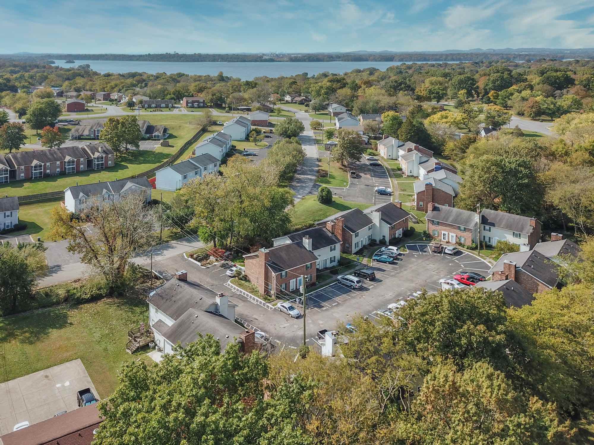 288 Donna Drive, Unit E Hendersonville, TN 37075 - Photo 20 of 23 an aerial view of a house with a garden and lake view