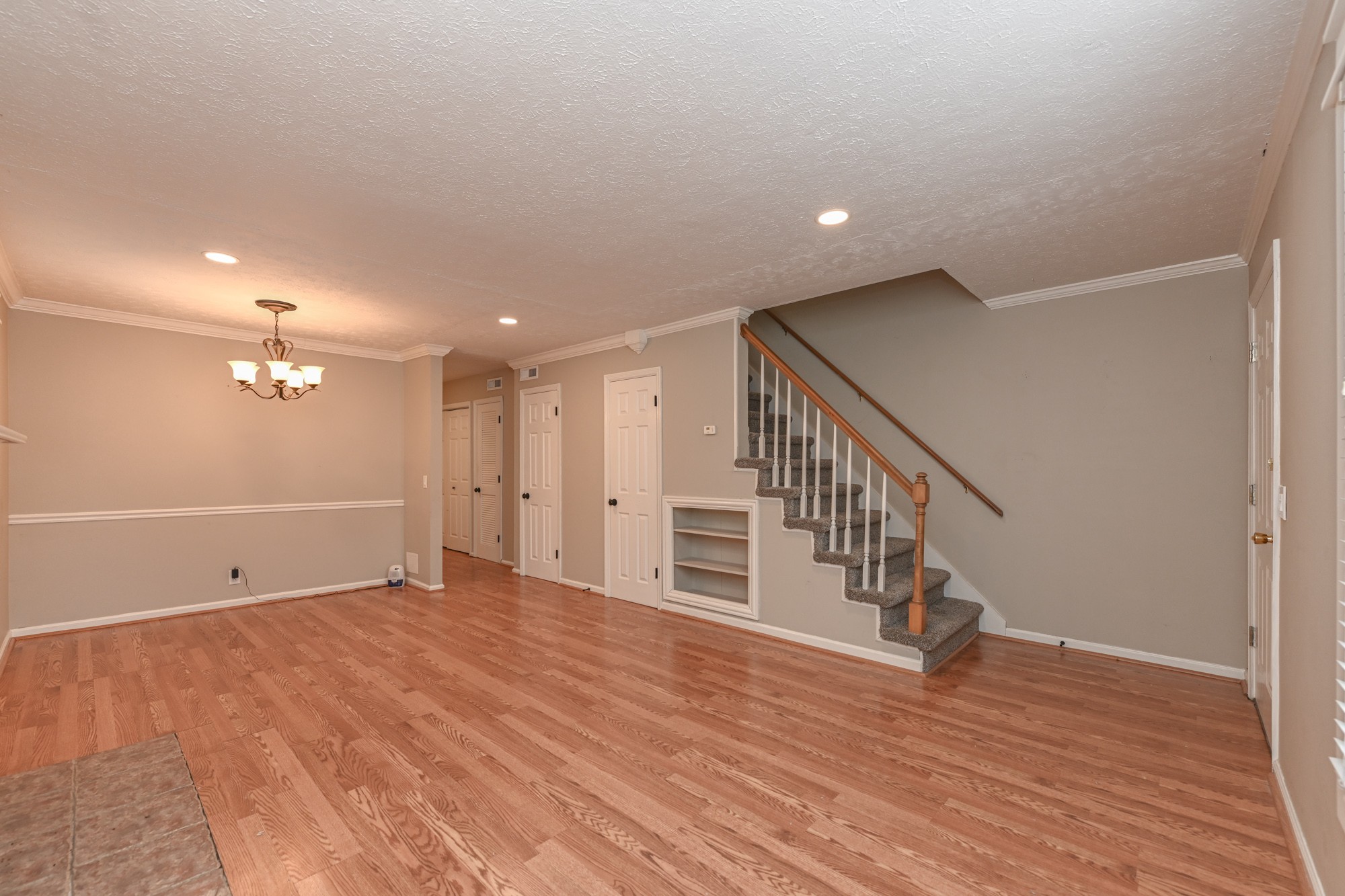 288 Donna Drive, Unit E Hendersonville, TN 37075 - Photo 6 of 23 a view of an empty room with wooden floor and stairs