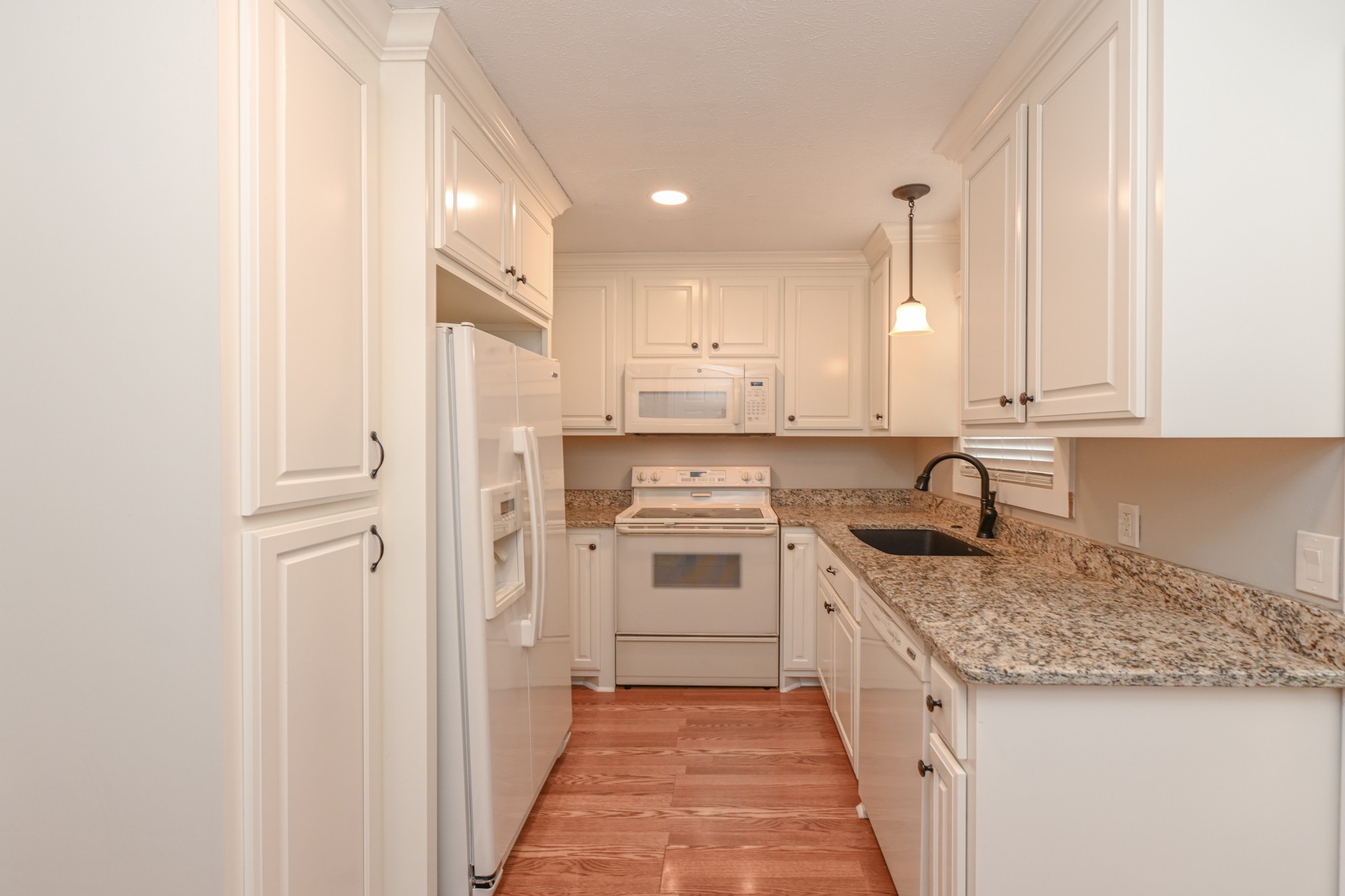 288 Donna Drive, Unit E Hendersonville, TN 37075 - Photo 8 of 23 a kitchen with stainless steel appliances granite countertop a stove and a sink