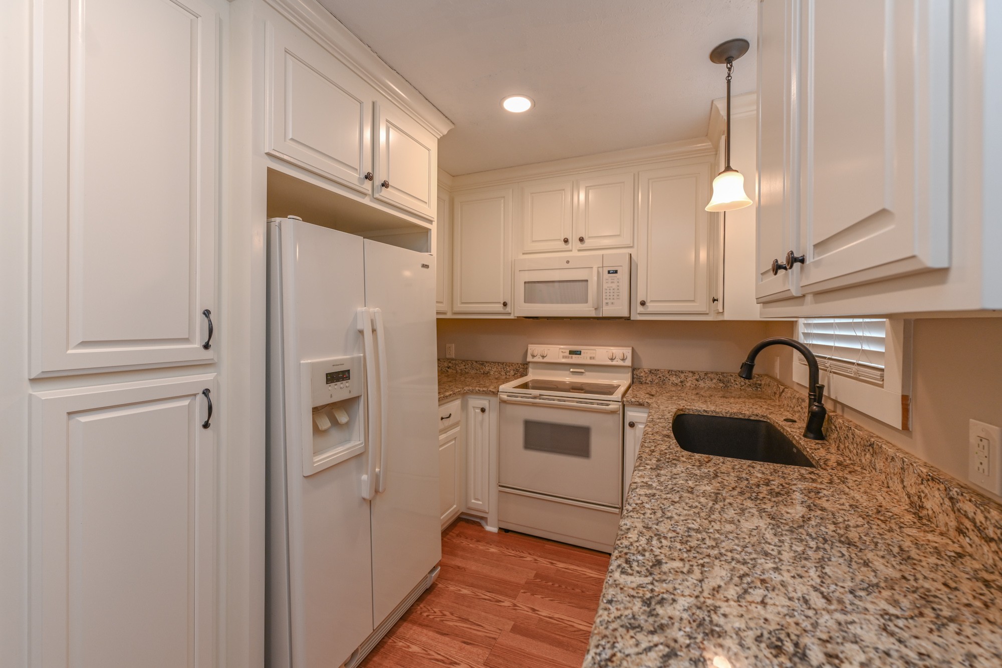 288 Donna Drive, Unit E Hendersonville, TN 37075 - Photo 9 of 23 a kitchen with white cabinets and stainless steel appliances