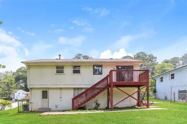 a view of house with yard
