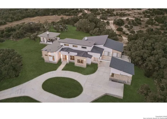 a aerial view of a house with a yard