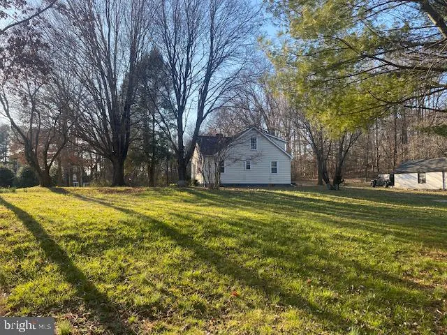 a view of a yard with trees