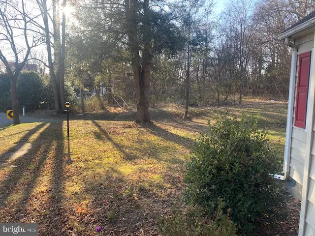 a view of a yard covered with snow