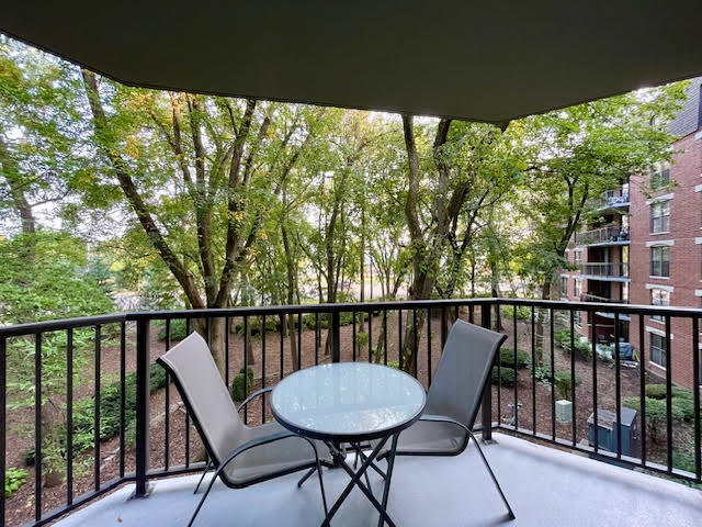 509 Aurora Avenue, Unit 308 Naperville, IL 60540 - Photo 11 of 22 a view of a balcony with furniture and wooden deck