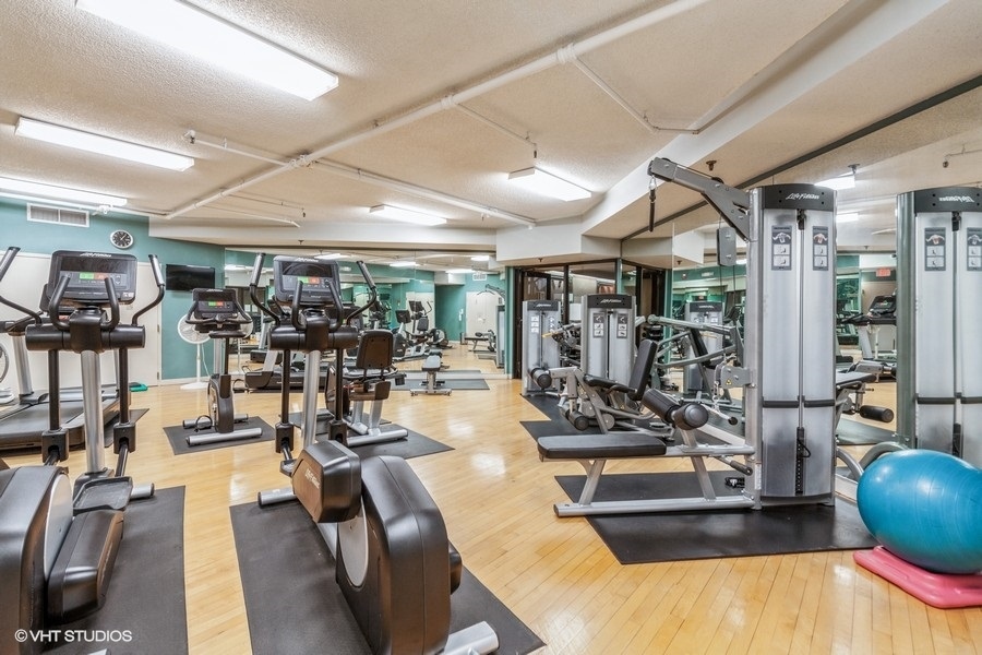 509 Aurora Avenue, Unit 308 Naperville, IL 60540 - Photo 13 of 22 a view of a room with gym equipment