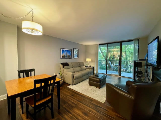 509 Aurora Avenue, Unit 308 Naperville, IL 60540 - Photo 3 of 22 a living room with furniture and a floor to ceiling window