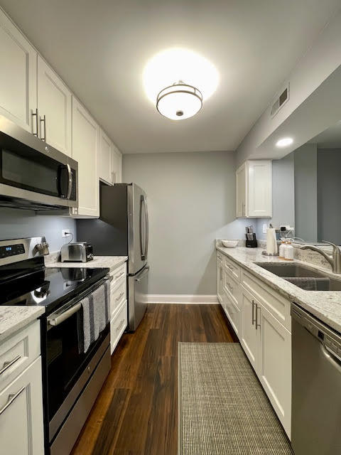 509 Aurora Avenue, Unit 308 Naperville, IL 60540 - Photo 6 of 22 a kitchen with stainless steel appliances granite countertop a sink and stove top oven