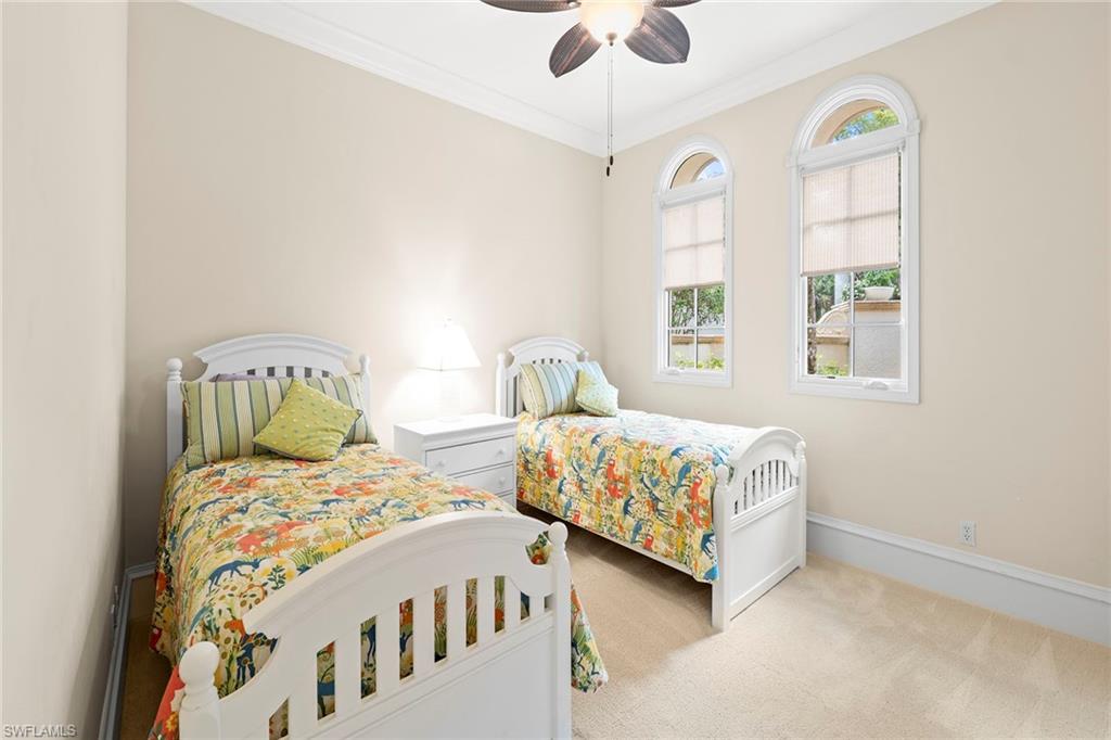 18071 Lagos Way Naples, FL 34110 - Photo 17 of 44 a bedroom with two beds and window