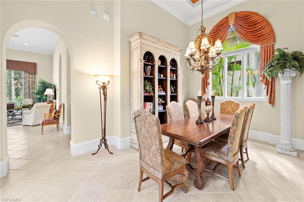 18071 Lagos Way Naples, FL 34110 - Photo 19 of 44 a view of a dining room with furniture chandelier and a chandelier