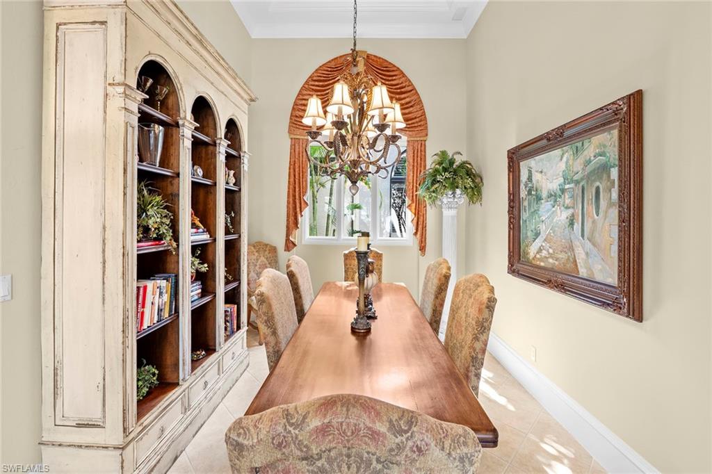 18071 Lagos Way Naples, FL 34110 - Photo 20 of 44 a view of a dining room with furniture and a window