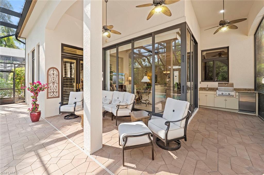 18071 Lagos Way Naples, FL 34110 - Photo 27 of 44 a view of an outdoor space with seating area
