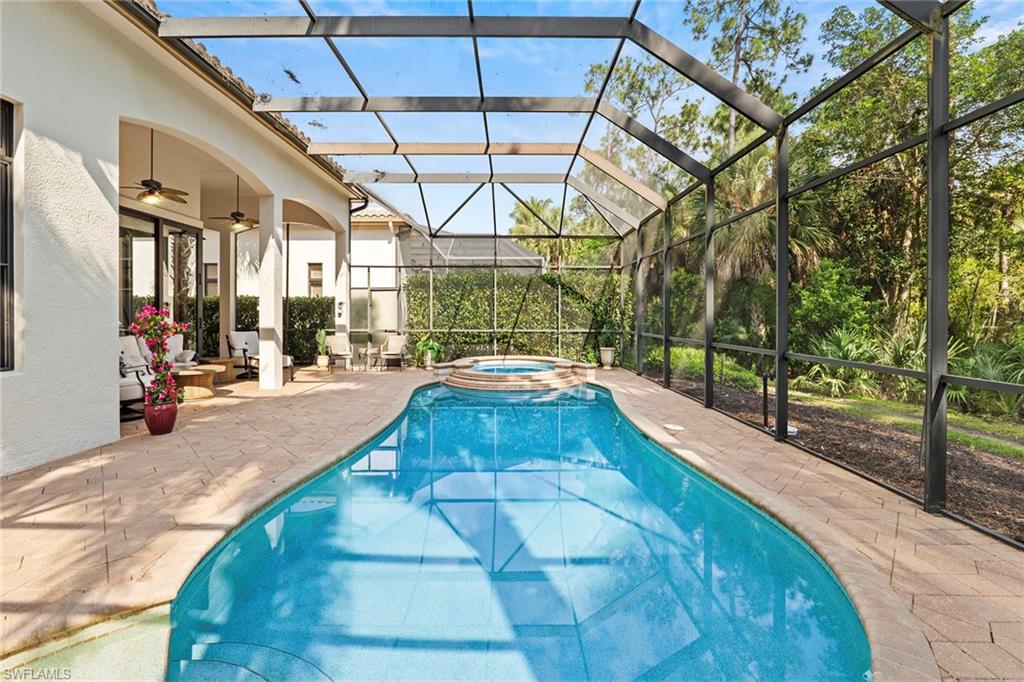 18071 Lagos Way Naples, FL 34110 - Photo 29 of 44 a view of swimming pool with seating area