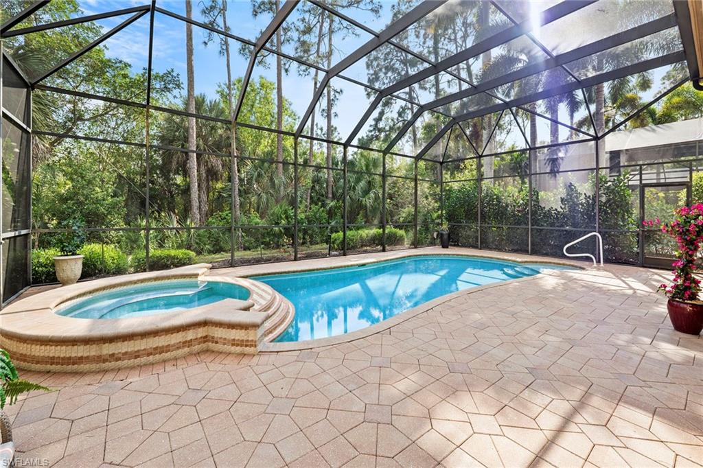 18071 Lagos Way Naples, FL 34110 - Photo 33 of 44 a view of a backyard with swimming pool