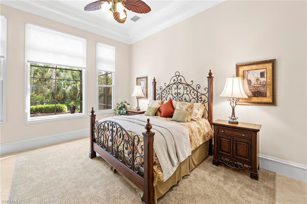 18071 Lagos Way Naples, FL 34110 - Photo 38 of 44 a bed sitting in a bedroom next to a window
